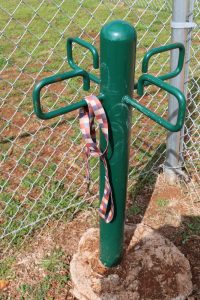 A dog park leash tree in Eagle Creek manufactured home community