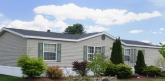 2024 Manufactured Home Shipments Eclipse 100,000 Florida Community Beige home with yard