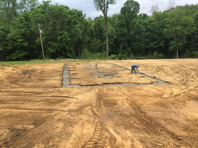 Bozz's Excavating Brandon Boswell preparing a site