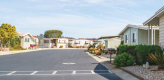 The Clock Is Ticking manufactured housing community street asphalt parking lots