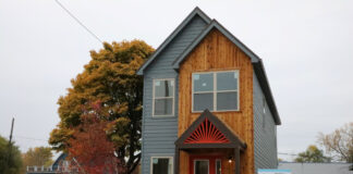 Champion Spearheads Detroit Infill Project detroit housing infill project champion innovalab gilbert foundation neighborhood factory built home virbrant entry fall colors