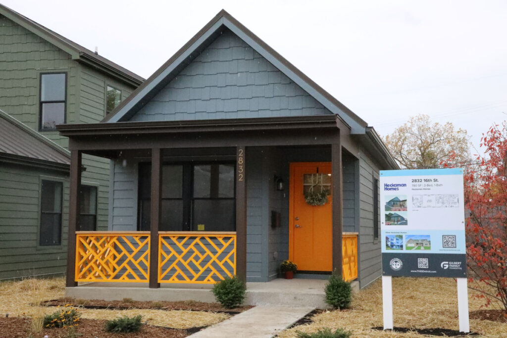 detroit housing infill project champion innovalab gilbert foundation neighborhood factory built home porch poppy colors