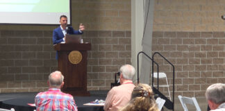 Congressman Headlines MH FacTOURy Summit northern indiana event center us rep congressman rudy yakym keynote address mh factoury summit 2025 audience listening manufactured housing