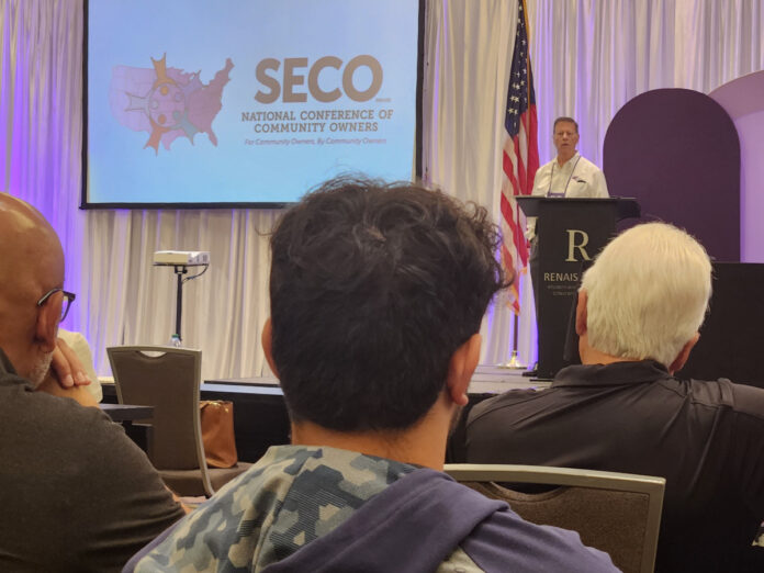 seco manufactured housing community owners meeting in atlanta september podium speaker and audience