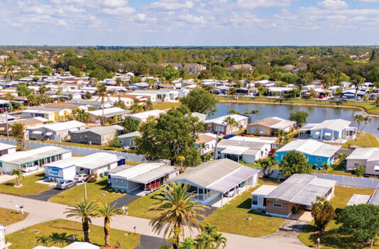 Manufactured Housing Gains Vertical Anchoring for Added Stability manufactured homes in a community setting aerial photo