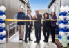 Champion Teams with Developer for Fresno, Calif., Village ribbon cutting between two homes balloons officials fresno manufactured housing attainable build to rent california mhinsider mhvillage