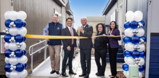 Champion Teams with Developer for Fresno, Calif., Village ribbon cutting between two homes balloons officials fresno manufactured housing attainable build to rent california mhinsider mhvillage