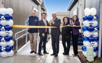 Champion Teams with Developer for Fresno, Calif., Village ribbon cutting between two homes balloons officials fresno manufactured housing attainable build to rent california mhinsider mhvillage