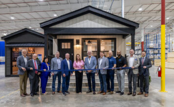 Clayton Opens First New Factory in 10 Years ribbon cutting new clayton factory arkansas governor sarah huckabee sanders