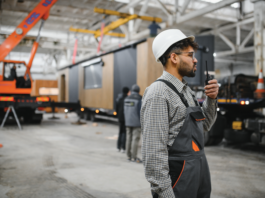 The Next Wave of Success in Factory-Built Home Retail worker man radio hardhat coveralls retail sales success john ace underwood sales strategy mhinsider magazine manufactured housing