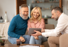 Rebuild How Homes Are Sold Online couple sits with rep browse homes online retail manufactured homes mhinsider magazine