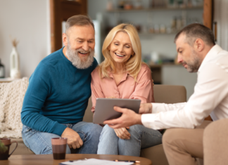 Rebuild How Homes Are Sold Online couple sits with rep browse homes online retail manufactured homes mhinsider magazine