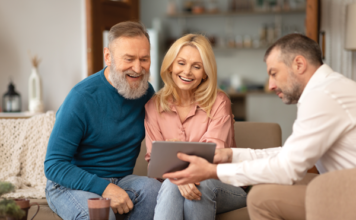 Rebuild How Homes Are Sold Online couple sits with rep browse homes online retail manufactured homes mhinsider magazine