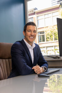 professinoal portrait environmental portrait man blue suit at desk brandon schilling brightstar way manufactured housing community midwest mh professionals mhinsider magazine